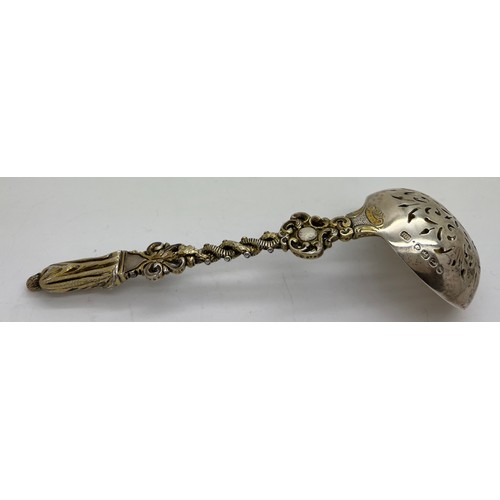 596 - A Victorian cast silver parcel gilt Apostle sifting spoon, 16cm l, weight 75gm. London 1872, maker H... 