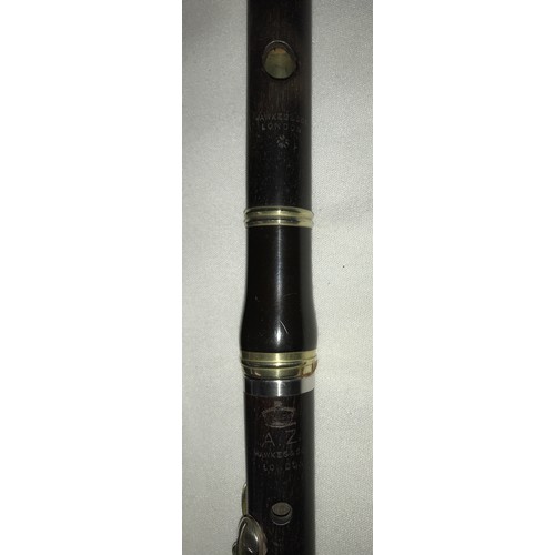 775 - A musical Fife by Hawkes & Son of London stamped with Royal crown AZ with leather case stamped Leath... 