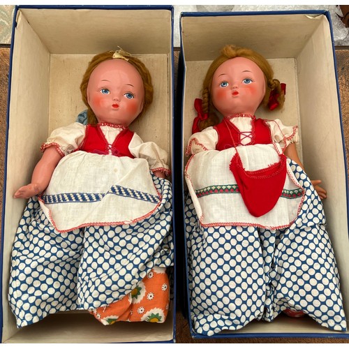 752 - Two Vintage costume dolls on tea cosies. 33cm l.