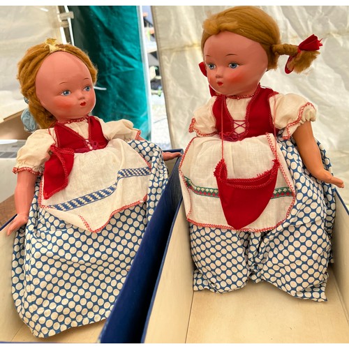 752 - Two Vintage costume dolls on tea cosies. 33cm l.