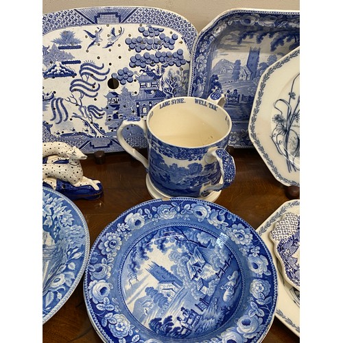 152 - A quantity of 19th and 20thC blue and white ceramics to include drainer 33 cm, square dish, Copeland... 