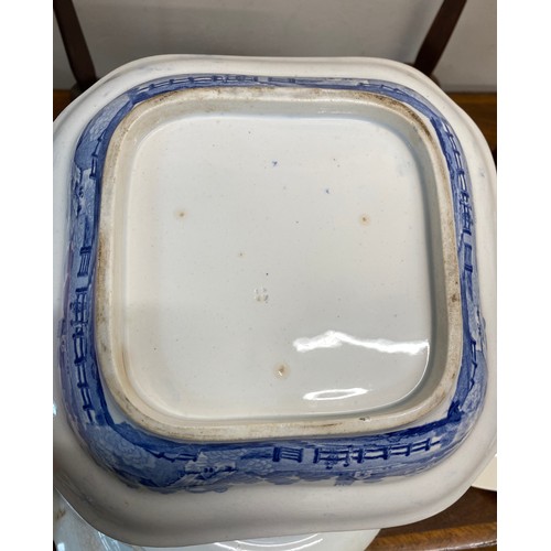 152 - A quantity of 19th and 20thC blue and white ceramics to include drainer 33 cm, square dish, Copeland... 