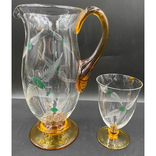 321 - A water set comprising jug and 6 glasses with amber bases and amber handle, etched leaf pattern. Jug... 