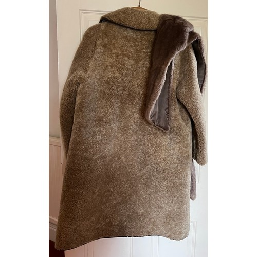 507 - A vintage sheepskin coat and fur stole with leather trim.