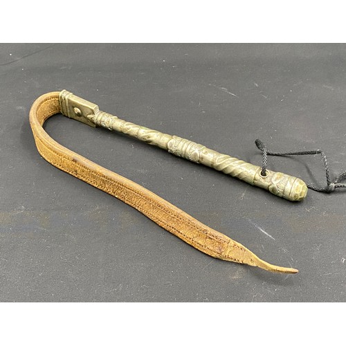 797 - A white metal handled leather whip.