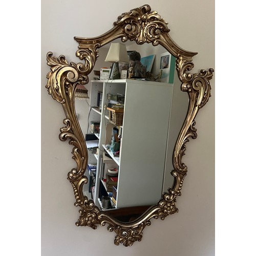 1356 - A gilt framed wall mirror. 74 x 53cm.