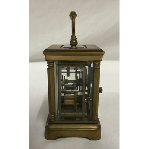 842 - Small brass, French carriage clock, for repair, has key 8.5cms h x 6cms w.