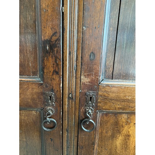 1303 - An 18th C Oak two door cupboard with shelved interior 127cm w x 42c d x 139cm h