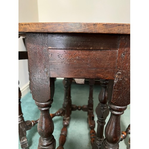 1305 - An 18th C oak gateleg table with drawer to one end 80cm x 70 cm open and 70cm x 27cm closed