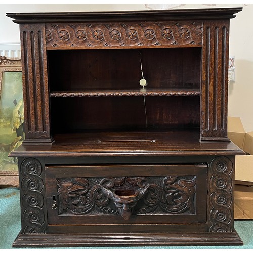 1308 - Carved oak cupboard, single door to base, shelf to top section, slot carved to top surface 71cm w x ... 