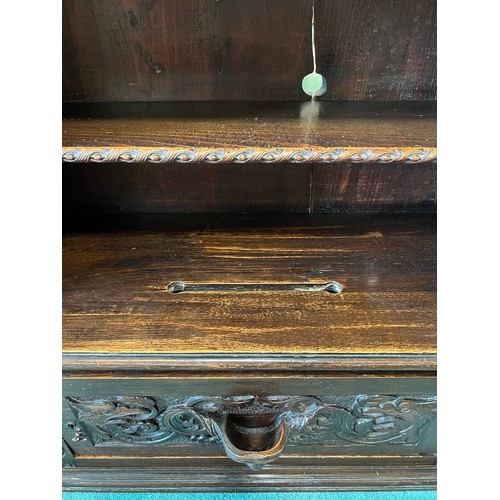 1308 - Carved oak cupboard, single door to base, shelf to top section, slot carved to top surface 71cm w x ... 