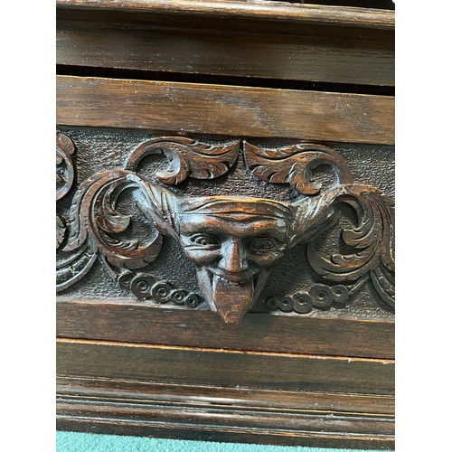 1308 - Carved oak cupboard, single door to base, shelf to top section, slot carved to top surface 71cm w x ... 