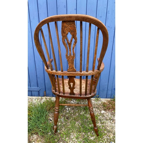 1311 - A 20thC Windsor chair. 107cm h.