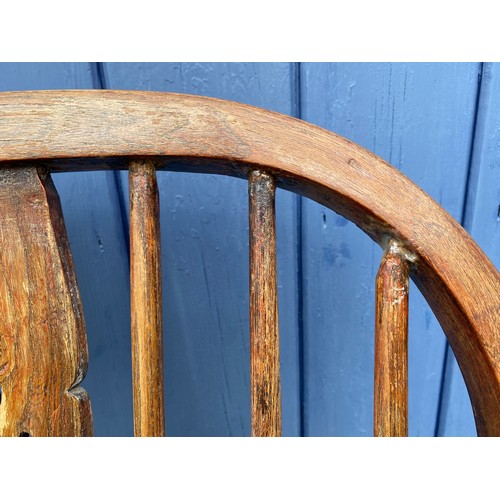 1311 - A 20thC Windsor chair. 107cm h.