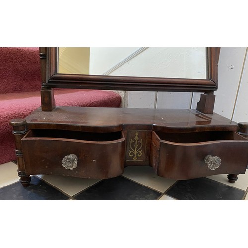 1312 - A mahogany swivel dressing table mirror with two drawers below.