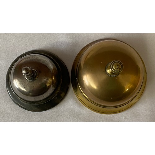 634 - Two counter top bells, one brass push down and one metal on onyx base with twist mechanism to top.