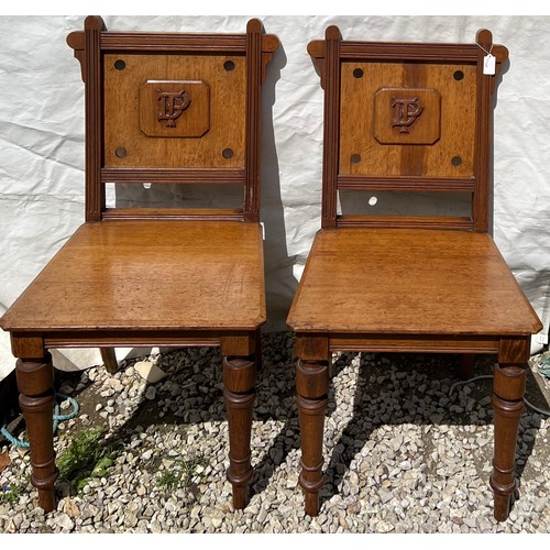 1315 - Two 19thC oak hall chairs with initials to back, D, P, T.