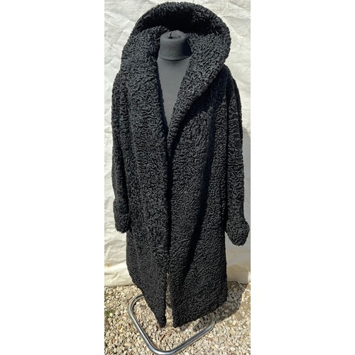 509 - A vintage curly Persian lamb coat. 56cm under arm to arm.