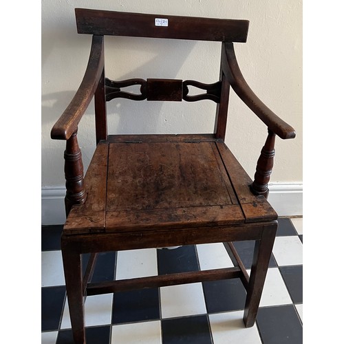 1320 - A 19thC mahogany commode, the seat lifting to reveal enamel pan and lid.