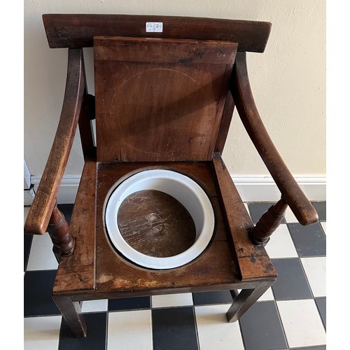 1320 - A 19thC mahogany commode, the seat lifting to reveal enamel pan and lid.