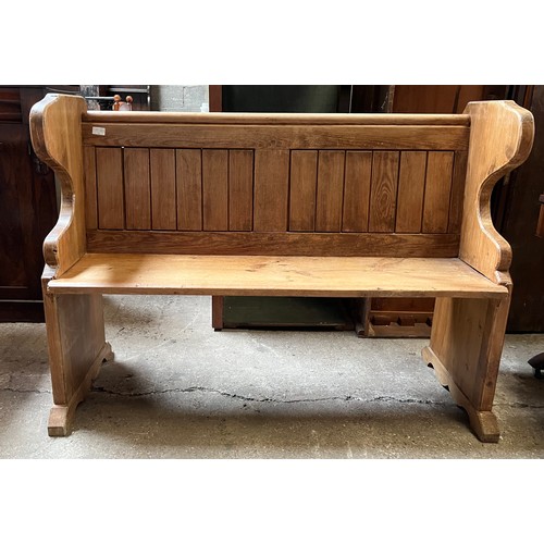 1325 - A pine settle with slatted back and club decoration to side. 127 w x 49cm x 93cm h.