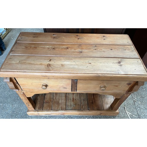 1328 - A pine 2 drawer side table. 113 w x 54 d x 86cm h.