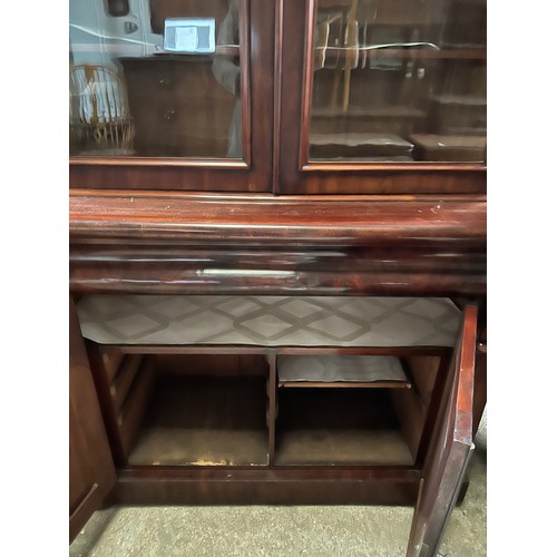 1331 - A 19thC mahogany bookcase, 2 glazed doors above 2 solid doors. 112 w x 48 d x 221cm h.