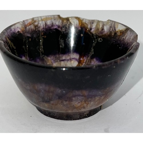 327 - A small turned Blue John bowl, raised on a slight foot. 4.7cm w.