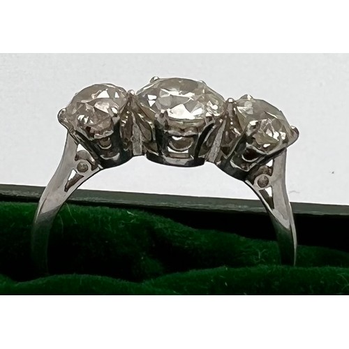 395 - A 3 stone diamond ring set in 18ct white gold, centre stone 1.4ct. 2.84ct in total. 4.5gm total. Siz... 