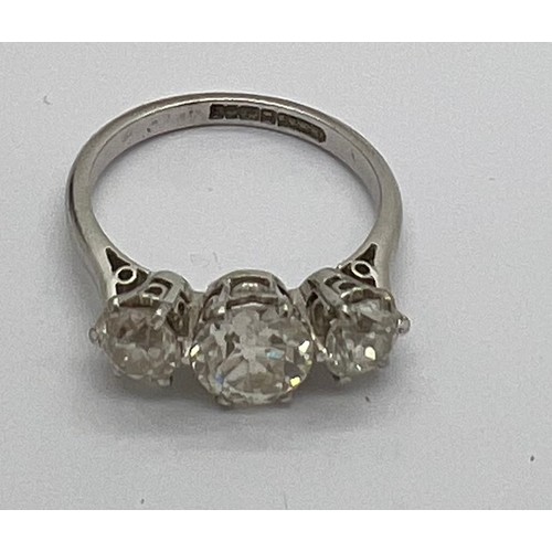 395 - A 3 stone diamond ring set in 18ct white gold, centre stone 1.4ct. 2.84ct in total. 4.5gm total. Siz... 