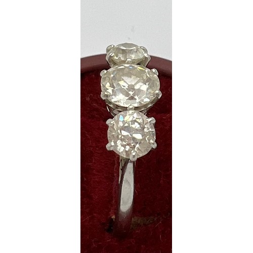 395 - A 3 stone diamond ring set in 18ct white gold, centre stone 1.4ct. 2.84ct in total. 4.5gm total. Siz... 