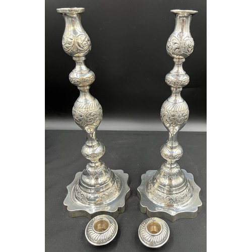 614 - A pair of silver Jewish Sabbath candlesticks, London 1929 with detachable sconces, engraved and chas... 