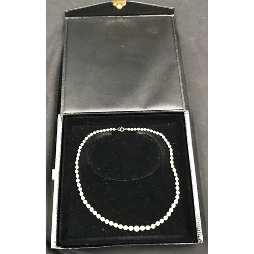 332A - A single strand of 75 cultured pearls graduating in diameter from approx. 6.5-7mm at the centre fron... 