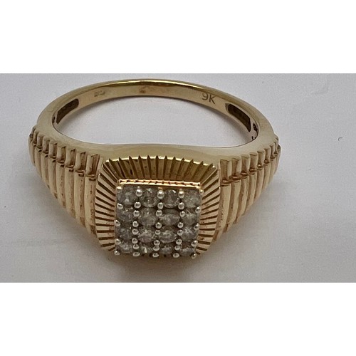 367 - A 9ct gold ring set with a square of diamonds and decoration to the shank. Size T, weight 4.3gm.