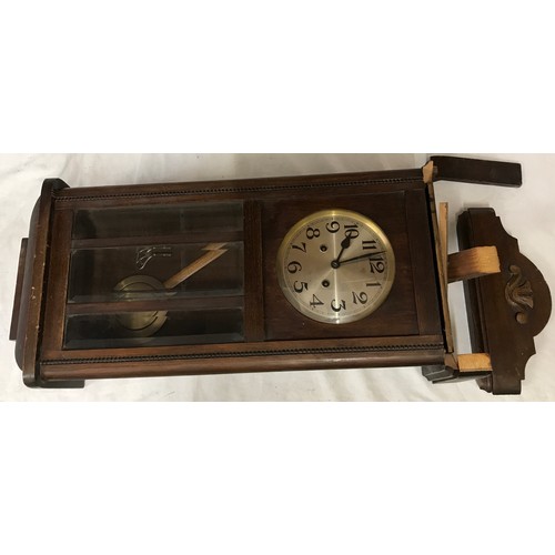 831 - Mahogany wall mounted clock measuring approx 81cms in length 34cms wide and 18cms deep believed to b... 