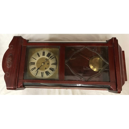 832 - Mahogany wall mounted clock with roman numerals on clock face. Believed to be working order, winds u... 