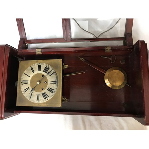 832 - Mahogany wall mounted clock with roman numerals on clock face. Believed to be working order, winds u... 