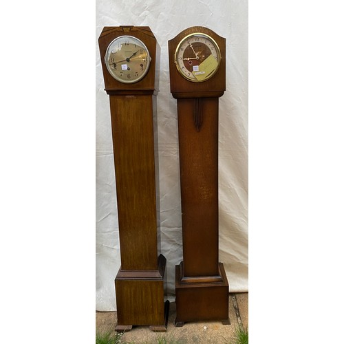 824 - Two wooden grandmother clocks believed to be in working order both 140cms high x 18cms deep one 27cm... 