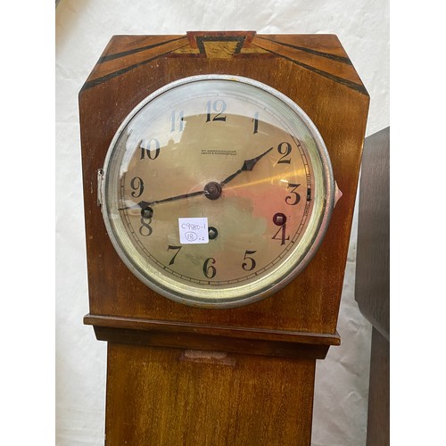 824 - Two wooden grandmother clocks believed to be in working order both 140cms high x 18cms deep one 27cm... 