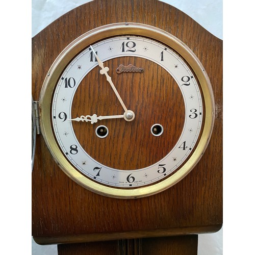 824 - Two wooden grandmother clocks believed to be in working order both 140cms high x 18cms deep one 27cm... 