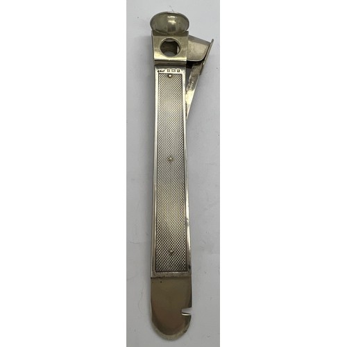 834A - A hallmarked silver cigar cutter with engine turned decoration, Birmingham 1959, maker possibly Will... 