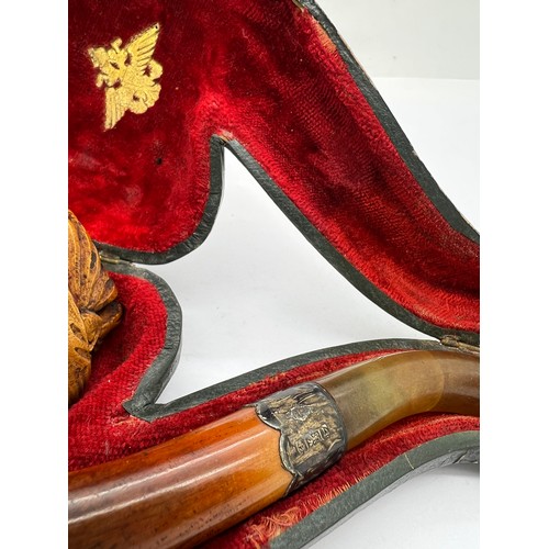 851A - A well patinated meerschaum pipe with figural female head, amber mouth piece and hallmarked engraved... 