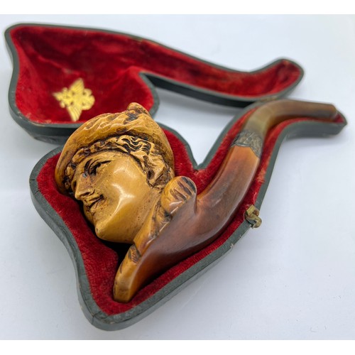 851A - A well patinated meerschaum pipe with figural female head, amber mouth piece and hallmarked engraved... 