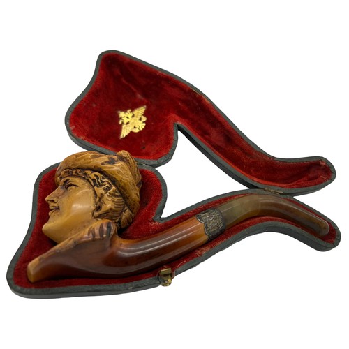 851A - A well patinated meerschaum pipe with figural female head, amber mouth piece and hallmarked engraved... 