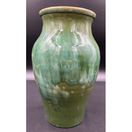 781A - A hand made Welsh Ewenny pottery vase with drip glaze in shades of green, signed to the base. 26cm h... 