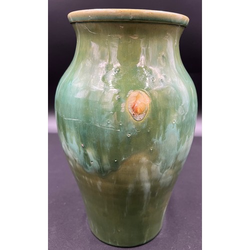 781A - A hand made Welsh Ewenny pottery vase with drip glaze in shades of green, signed to the base. 26cm h... 