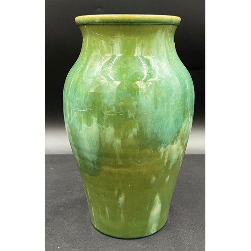 781A - A hand made Welsh Ewenny pottery vase with drip glaze in shades of green, signed to the base. 26cm h... 