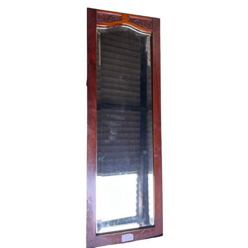 1354 - A mahogany framed bevel edged wall mirror. 79 x 26cm.