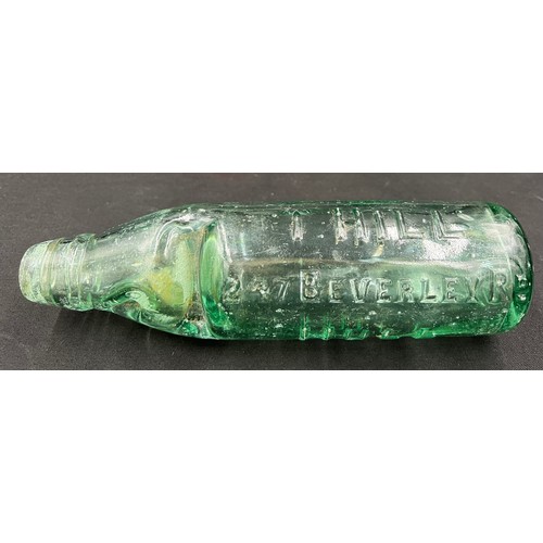 1038A - An early 20thC Codd bottle with raised lettering for T. Hill, 247 Beverley Road, Hull. 23cm h.