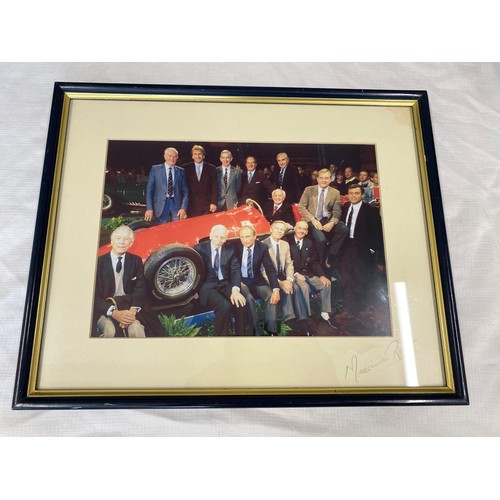 851B - A framed photograph of 13 Ferrari  drivers taken at the Essen Motor show in 1995. Luigi Villoresi se... 